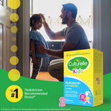 Man and child interacting with a Culturèle Kids multivitamin and probiotic package.