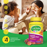 Woman and child with a bottle of Culturelle Kids probiotic supplement on a green background