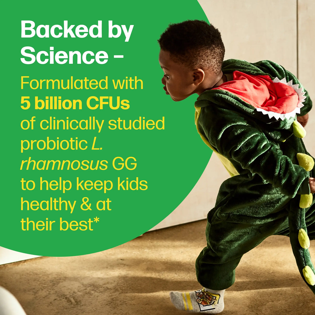 Child in dinosaur costume with promotional text about probiotics on a green background